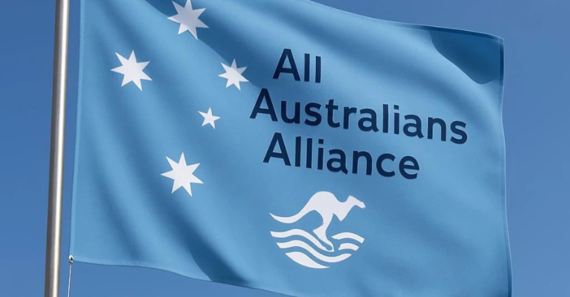 The All Australians Alliance flag flying against a blue sky